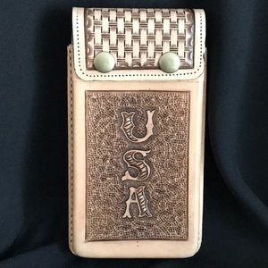 Handmade all leather cell phone carrier.